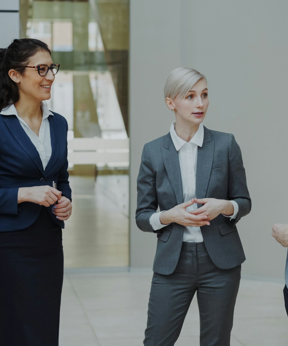 Professionals meeting in a modern office lobby